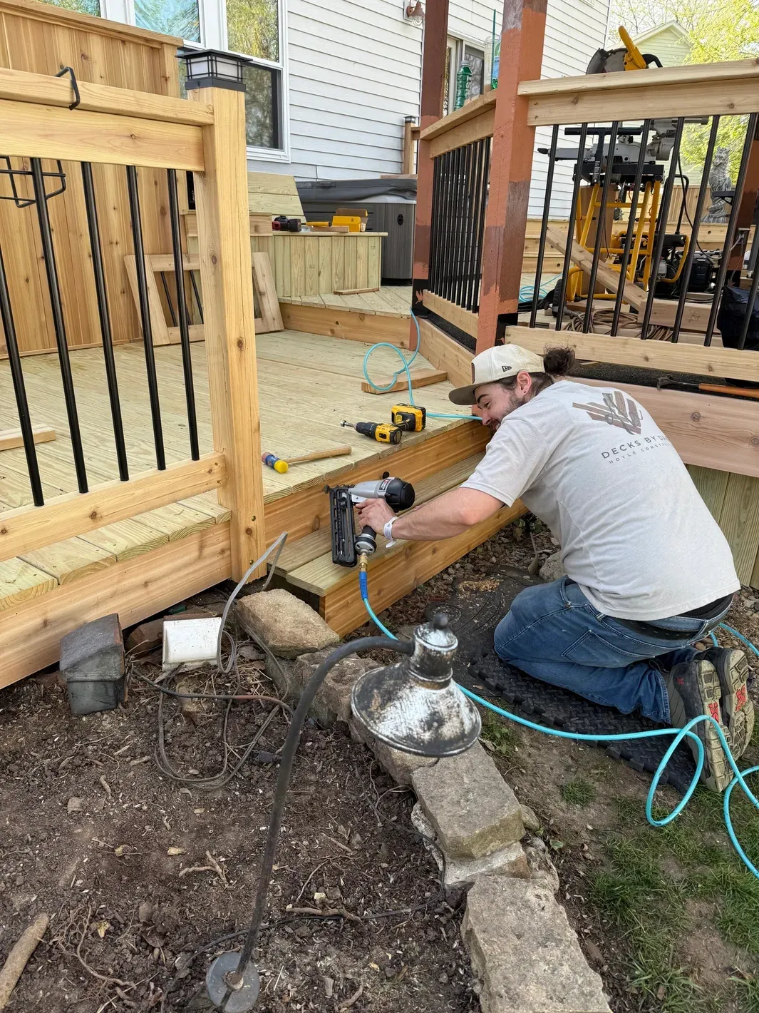 Carpenter working on wooden deck